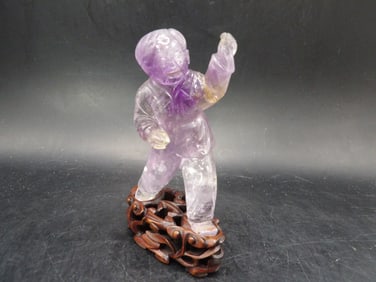 Chinese antique carved amethyst boy adhered to wooden base