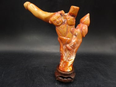 Chinese coral carved boy statue adhered to wooden base