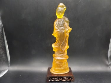 Chinese amber Kwan Yin figurine with wooden base