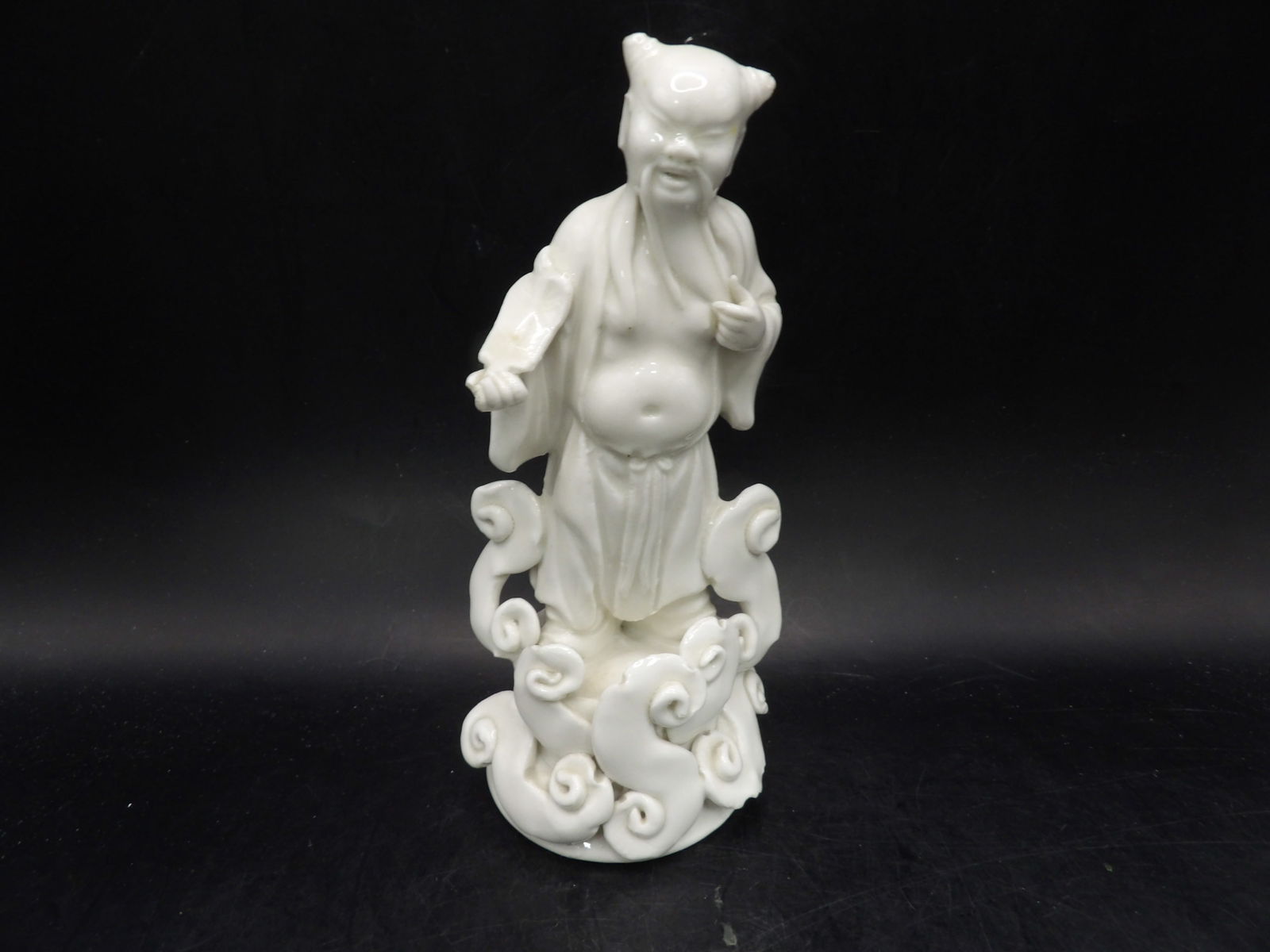 Chinese Dehua porcelain immortal figurine standing on clouds (1 of 4)