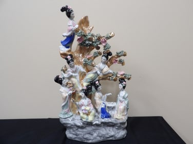 large Chinese porcelain sculpture depicting 7 goddesses surrounded by money tree