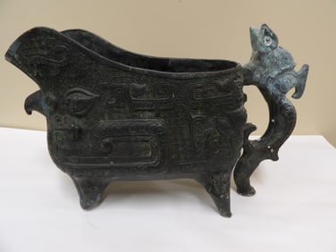 Chinese bronze vessel with dragon handle
