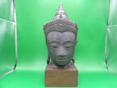 antique Asian Thai bronze buddha head mounted on wood base