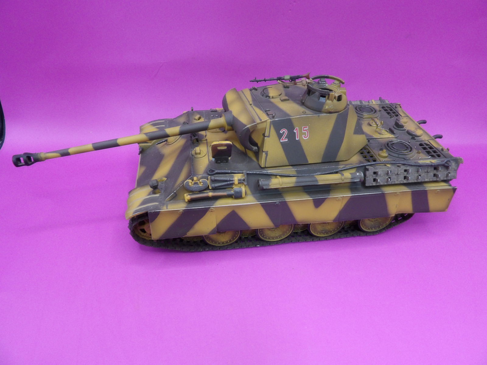 Forces of Valor German Panther tank from WWII marked 215: Tank body is 8.4 inches length. With cannon about 11 inches length.