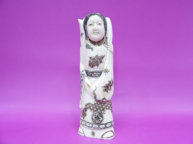 fine carved Japaneses woman's figurine signed on the bottom