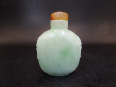 Chinese jade carved snuff bottle with mask handles and agate stopper