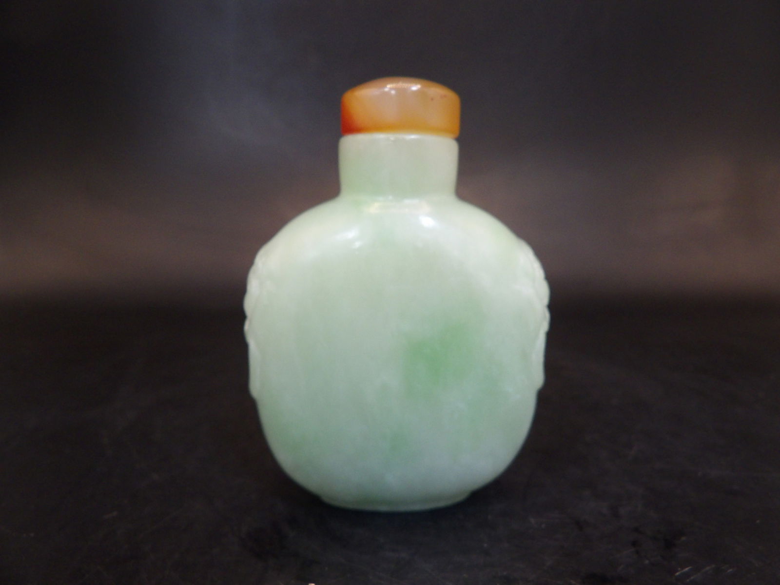 Chinese jade carved snuff bottle with mask handles and agate stopper (1 of 8)