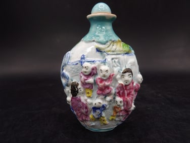 antique Chinese molded porcelain snuff bottle with Qing dynasty Qianlong mark