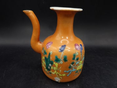 antique Chinese porcelain vessel with hand painted flowers