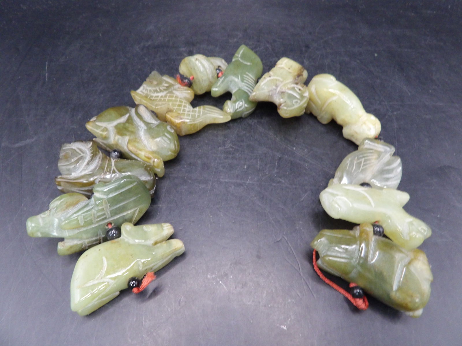 Chinese jade carved 12 zodiac animals on a string: 236 grams.