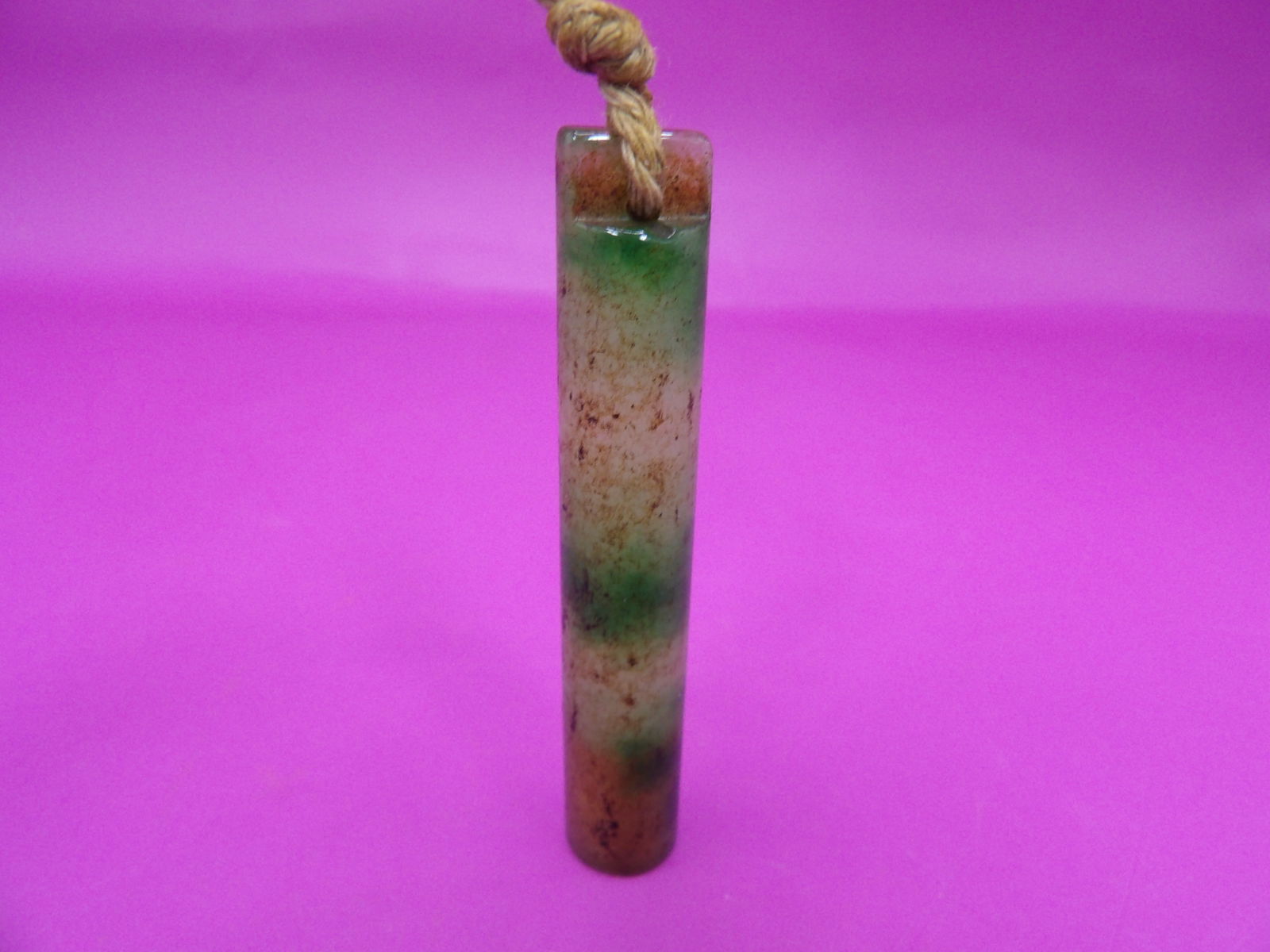 Chinese jadeite jade carved tube shaped pendant: 2.5 inches height. 13 grams.