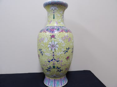 Chinese famille rose porcelain vase with yellow ground and ornate floral motifs