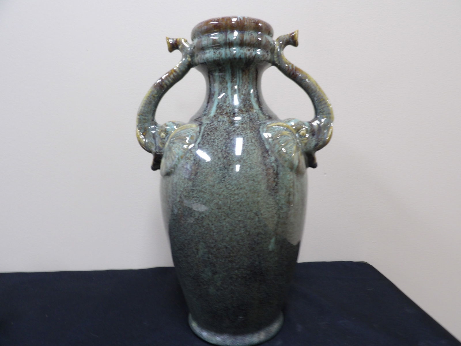 Asian mottled teal glazed ceramic vase with elephant head handles: 14.5 inches height.