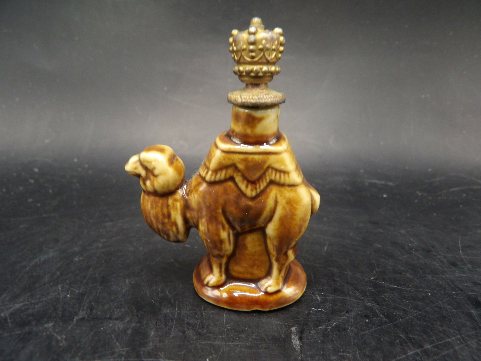 1930s ceramic camel-shaped perfume bottle with crown stopper made in Germany (1 of 6)