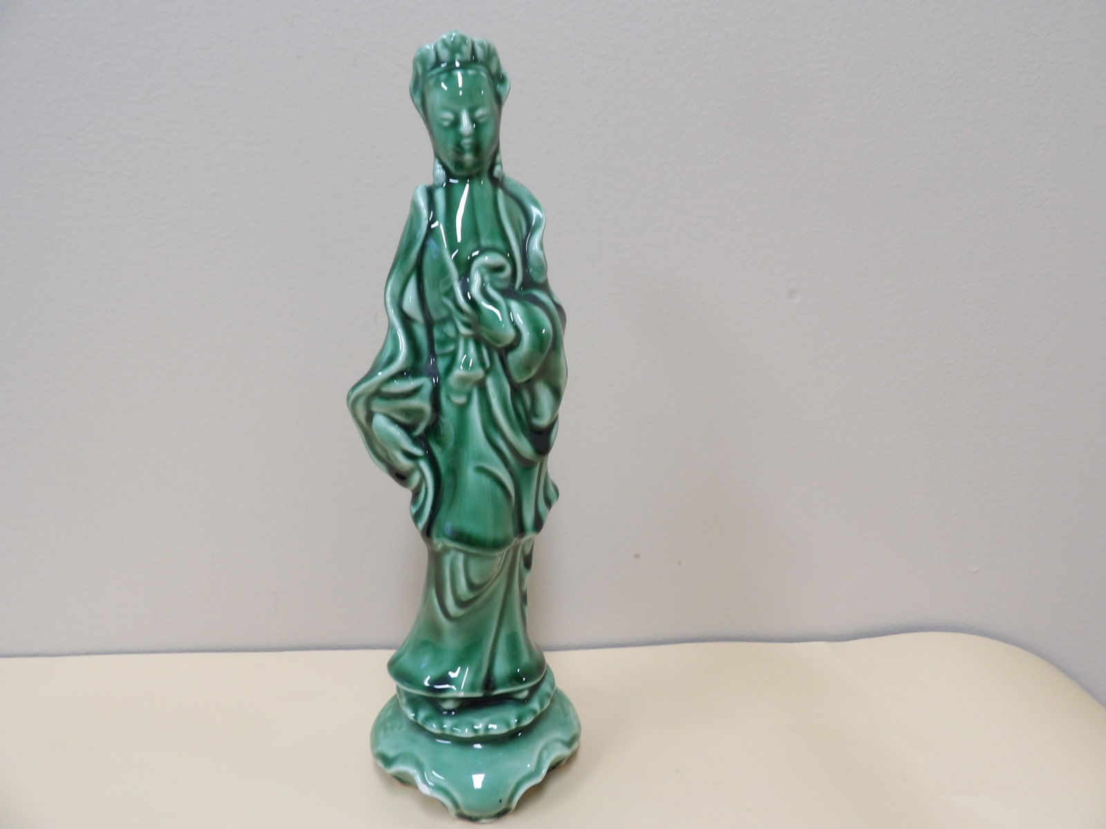 green glazed ceramic figurine with a woman in traditional Asian attire (1 of 8)
