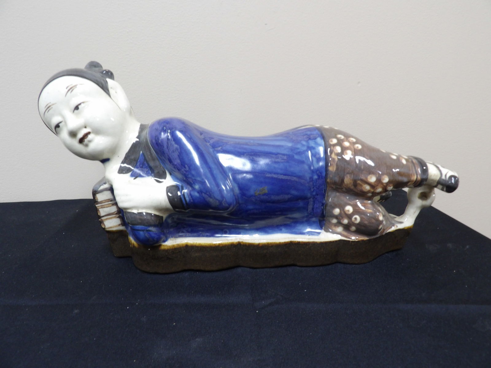 19th century Chinese Cizhou porcelain reclining figural pillow: 15.5 inches length.