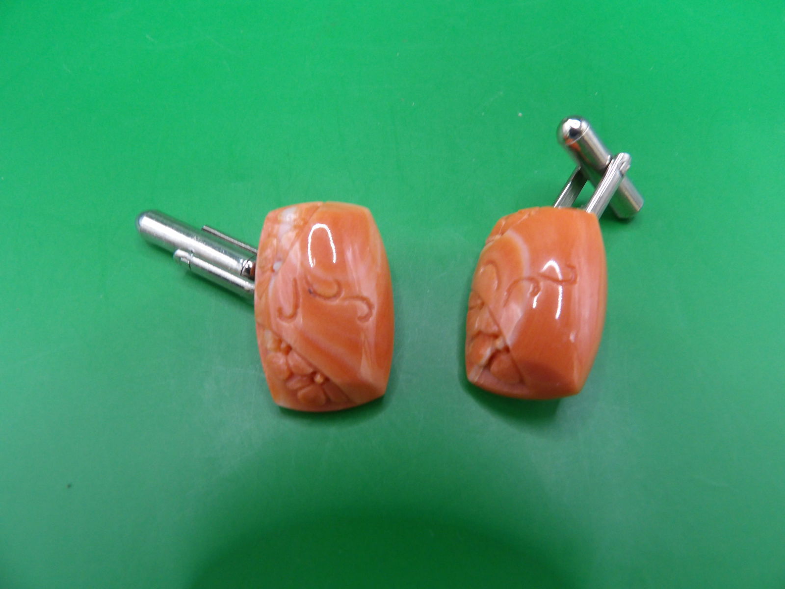 carved angel skin coral cuff links: 0.8 inches height.