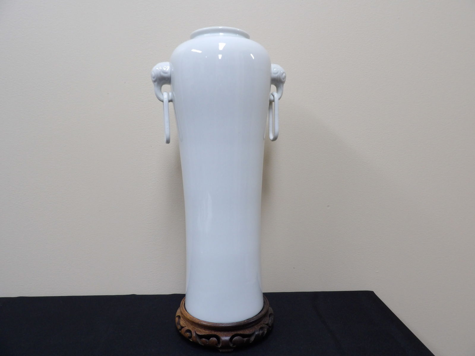 Asian blanc de china tall porcelain vase with elephant ears and rings: 16.5 inches height not including wooden base. Probably Chinese. Bottom dark brown area is old paper.