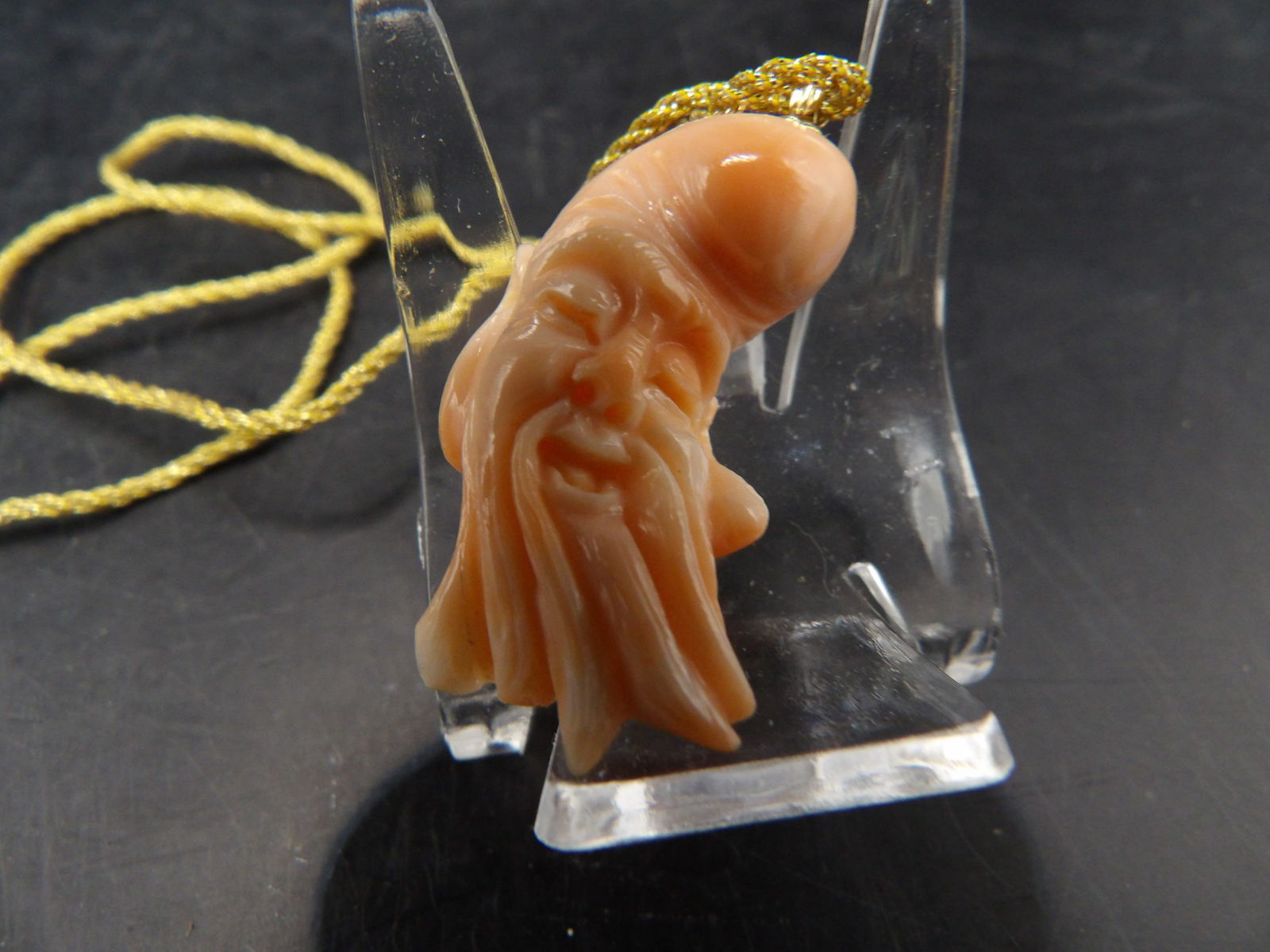 angel skin coral carved Longevity God pendant with 14k gold bail: Pendant including bail is 1.3 inches height. Necklace is gold color cord.