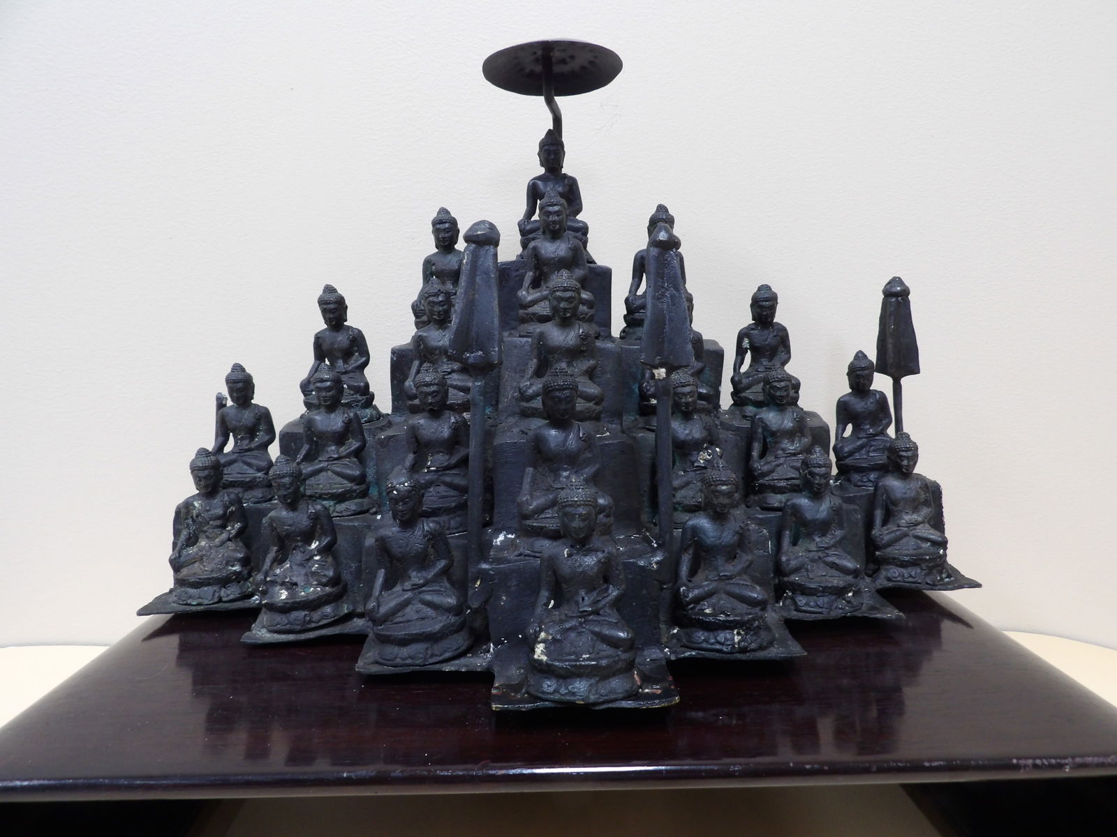Very rare Javanese temple large bronze sculpture depicting 23 seating buddha: Bronze statue is 16.5 x 10.5 x 8 inches. Wooden base was later matched with 17.5 x 11.5 x 2.5 inches size.