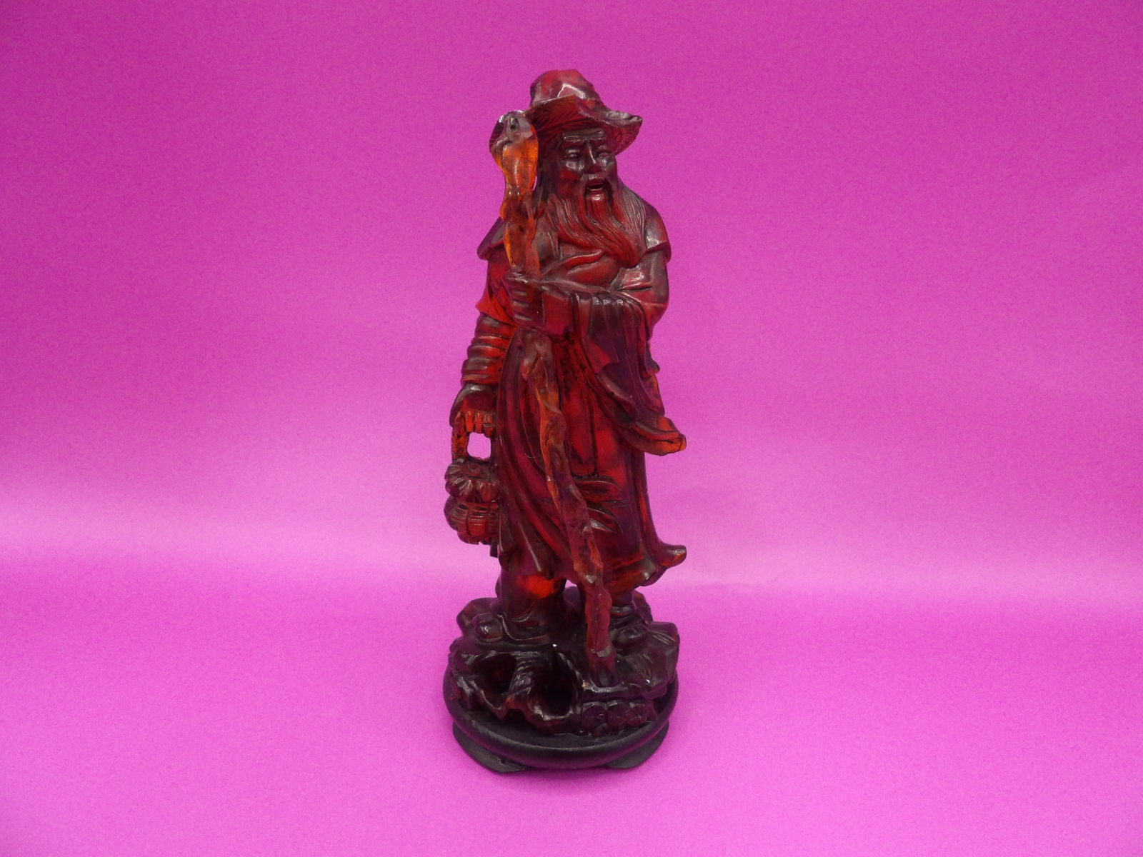 Antique Chinese amber fisherman statue on wooden base: 6.6 inches height with wooden base.