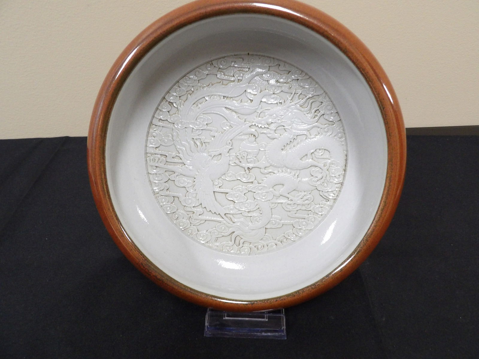 Chinese carved phoenix porcelain brush pot signed: 8.5 inches length.