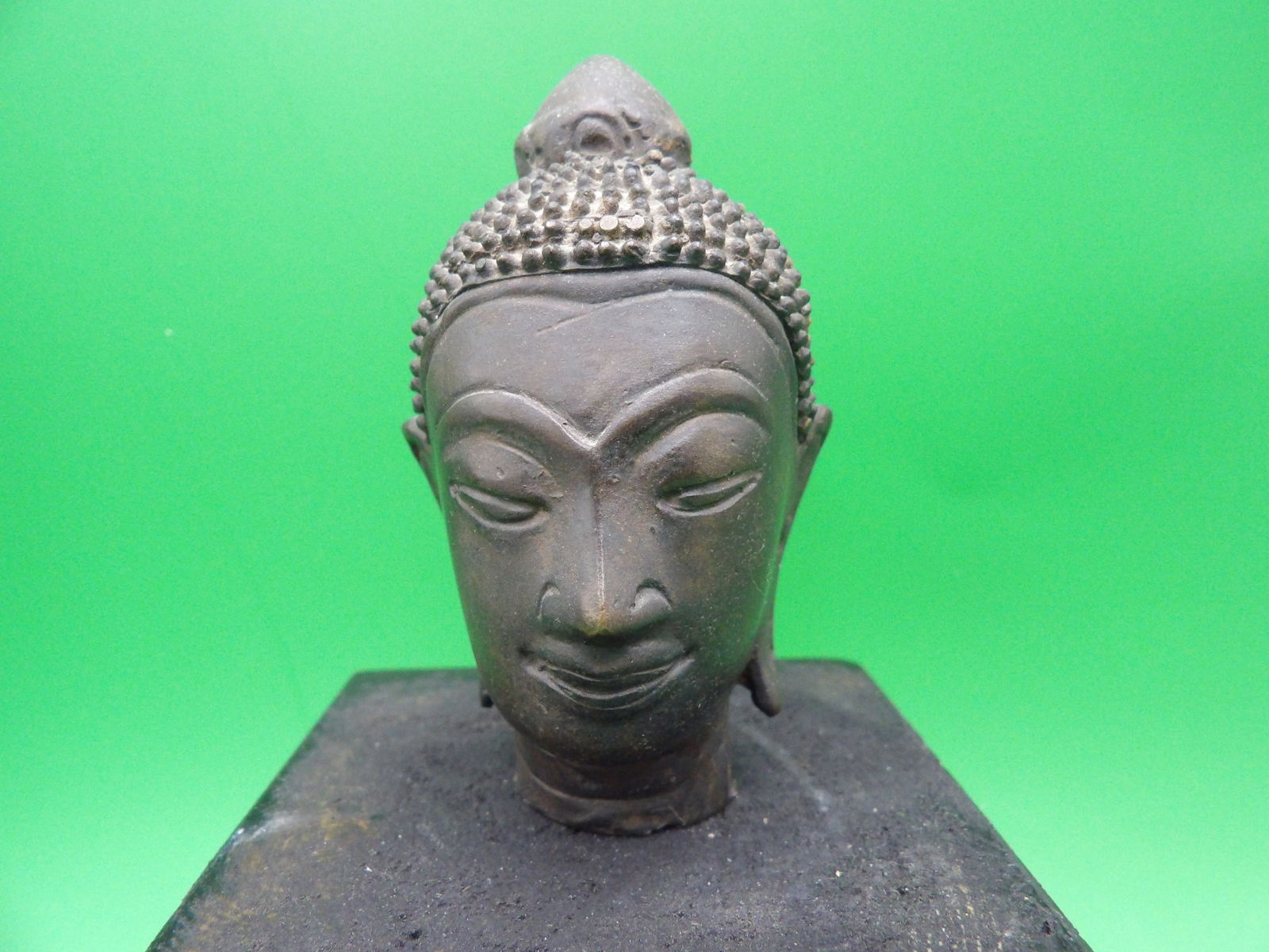 Antique Asian Thai small bronze buddha head with wood base (1 of 6)