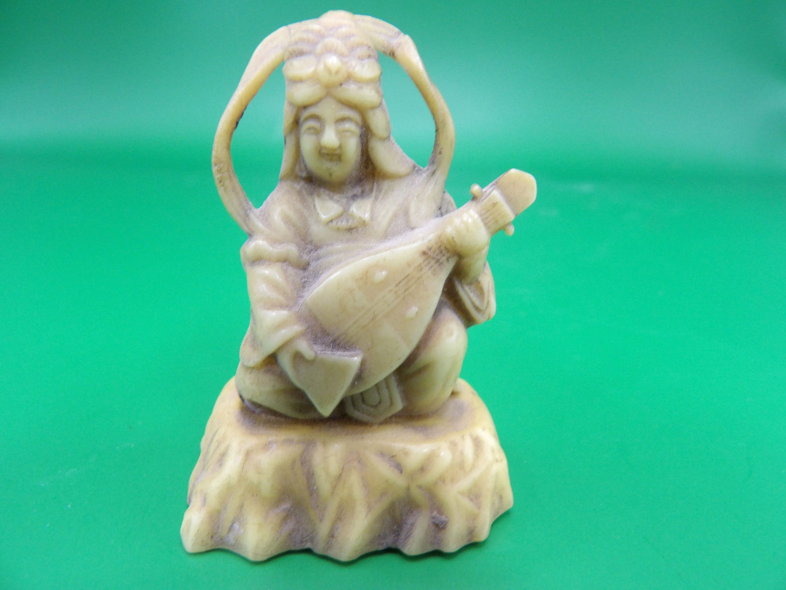 Japanese bakelite netsuke figurine signed on the bottom (1 of 4)