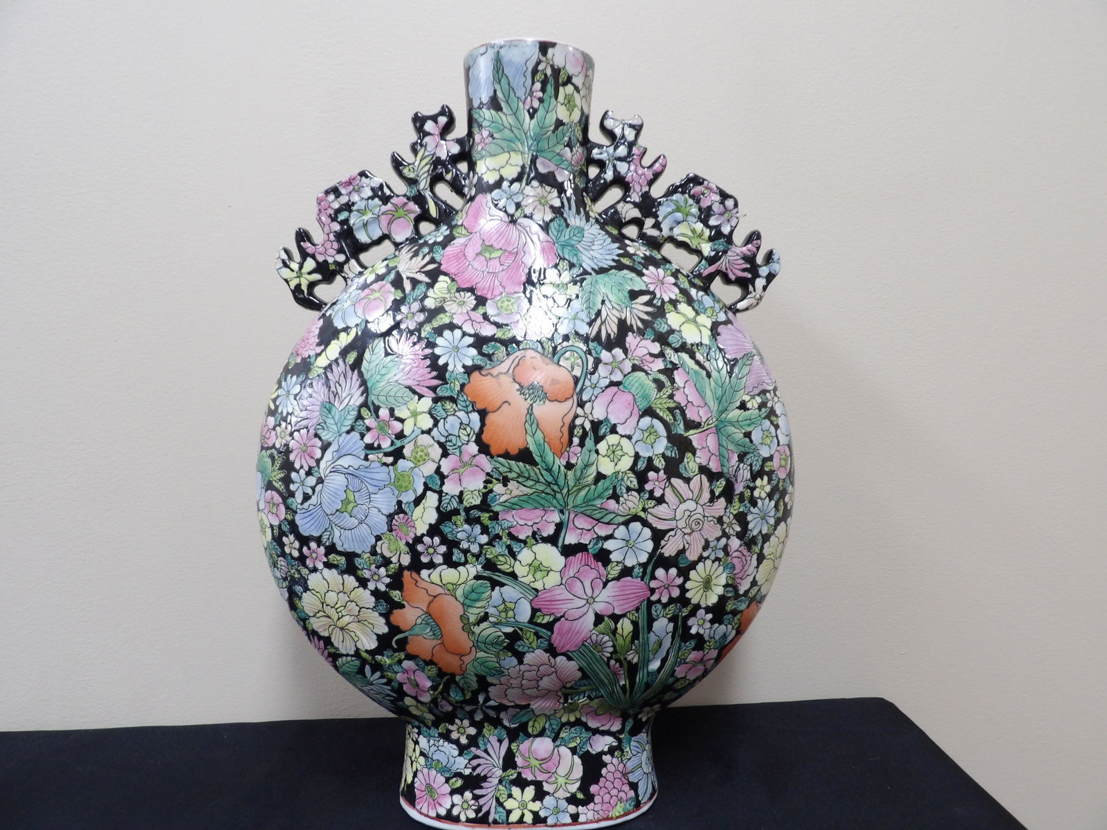 Chinese famille Noir Millefleur porcelain moon vase with handles signed vibrant colors: Approx. 18 inches height.