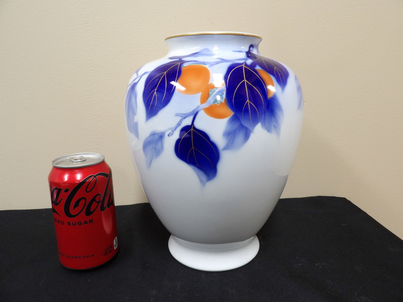 Imperial household mark Fukagawa porcelain vase with persimmons and blue leaves: 10 inches height.