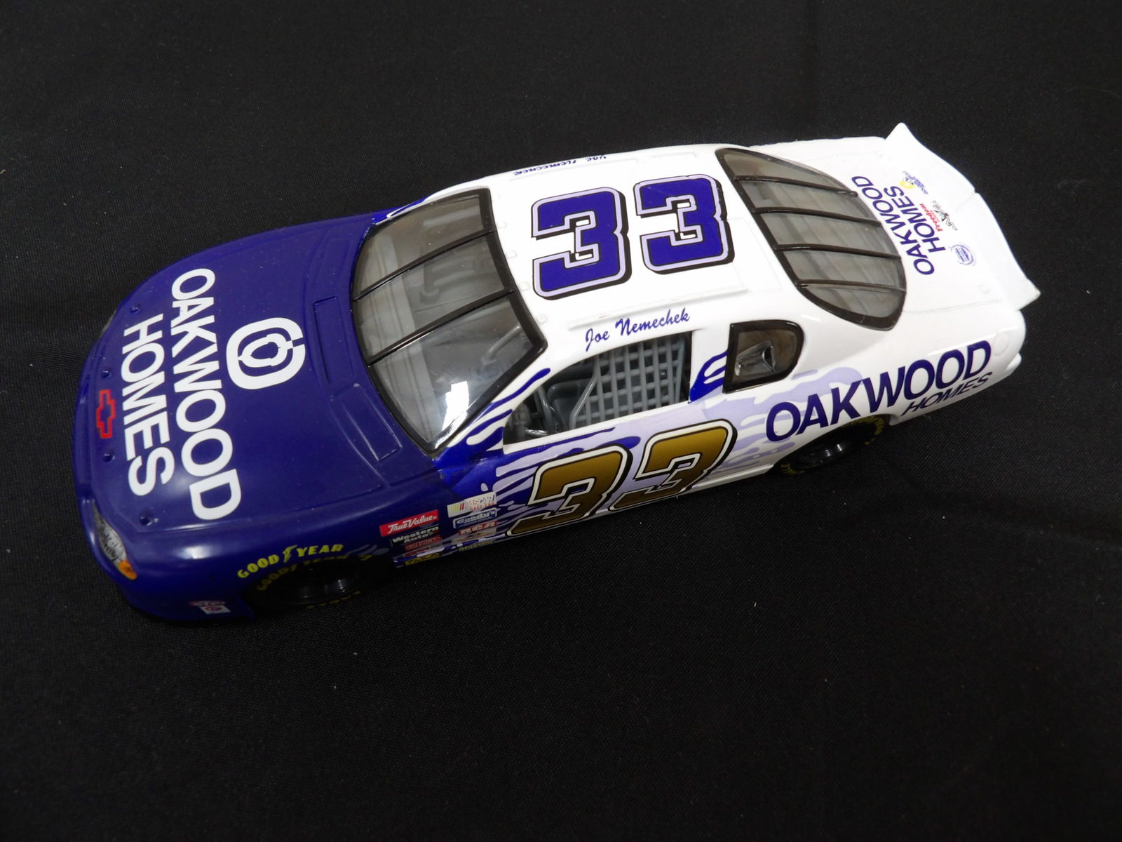 1:24 diecast model of Joe Nemechek's #33 Oakwood Homes Nascar car: 8 inches length.