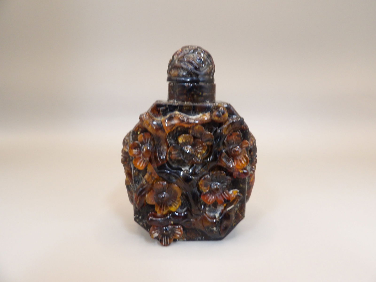 Chinese amber carved cherry blossom snuff bottle with mask handles (1 of 7)