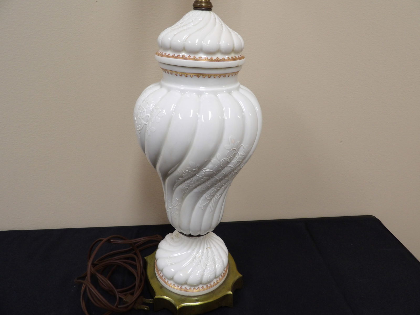 Antique white porcelain swirl design floral pattern lamp: 28 inches height.