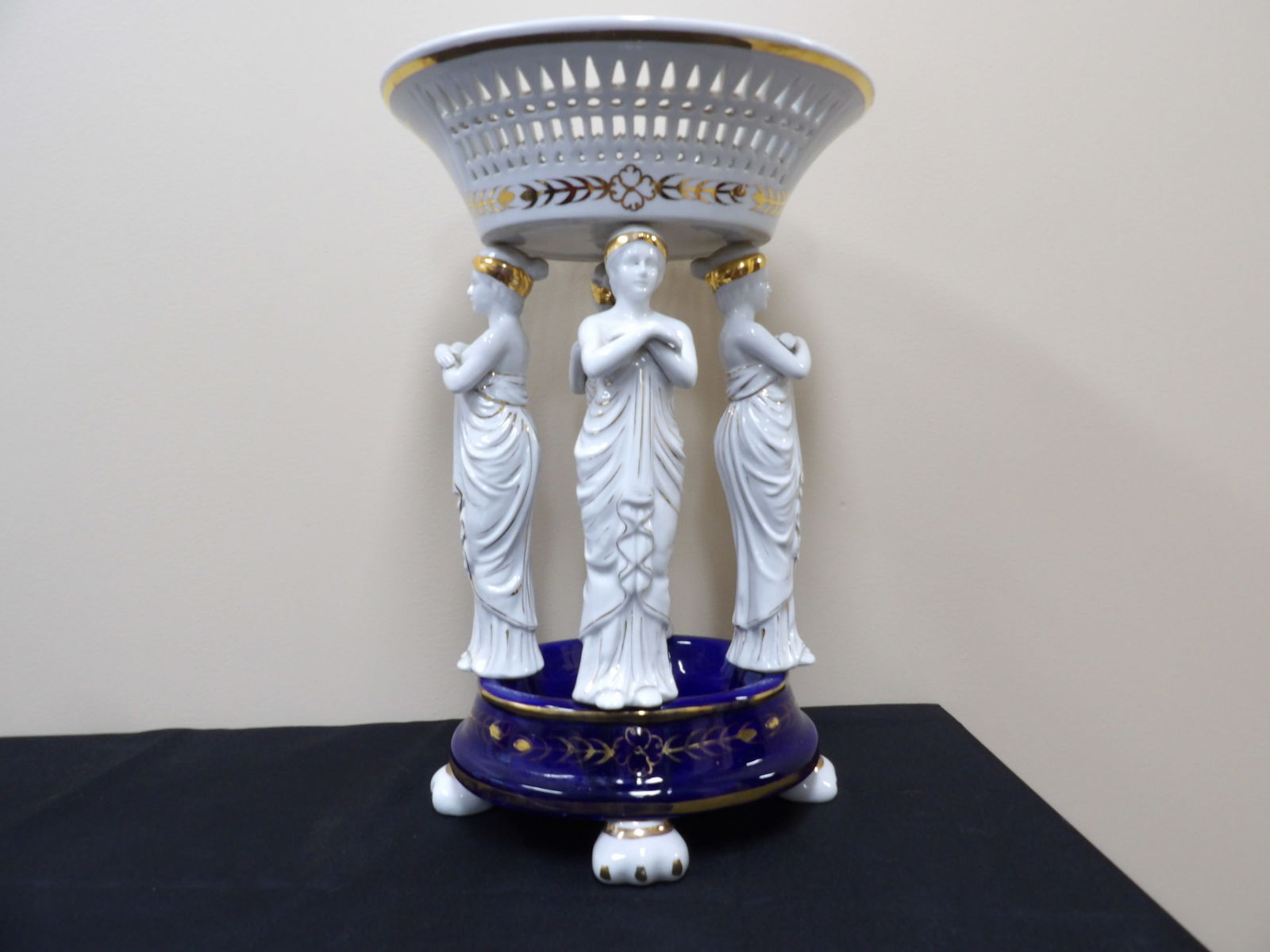 rare antique 19th century French porcelain centerpiece with draped figures: 17 inches height.
