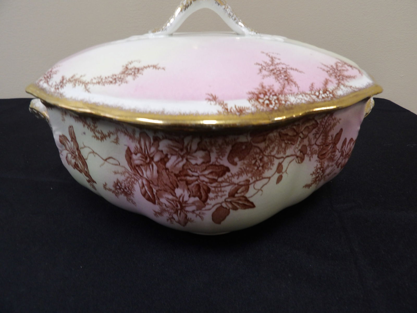 antique Clifford England lidded casserole dish with pink wash and floral pattern: Late 19th century. Approx. 11 inches length.