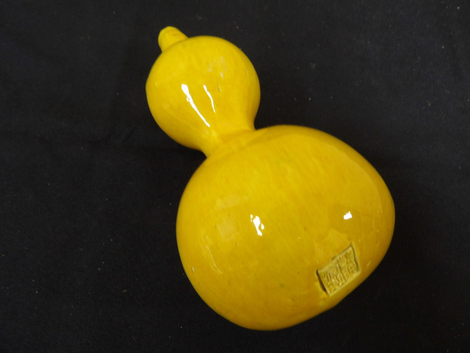 Chinese porcelain yellow glazed double gourd with Qing dynasty Qianlong mark: Size is approx 3.3 x 3.3 x 7 inches.