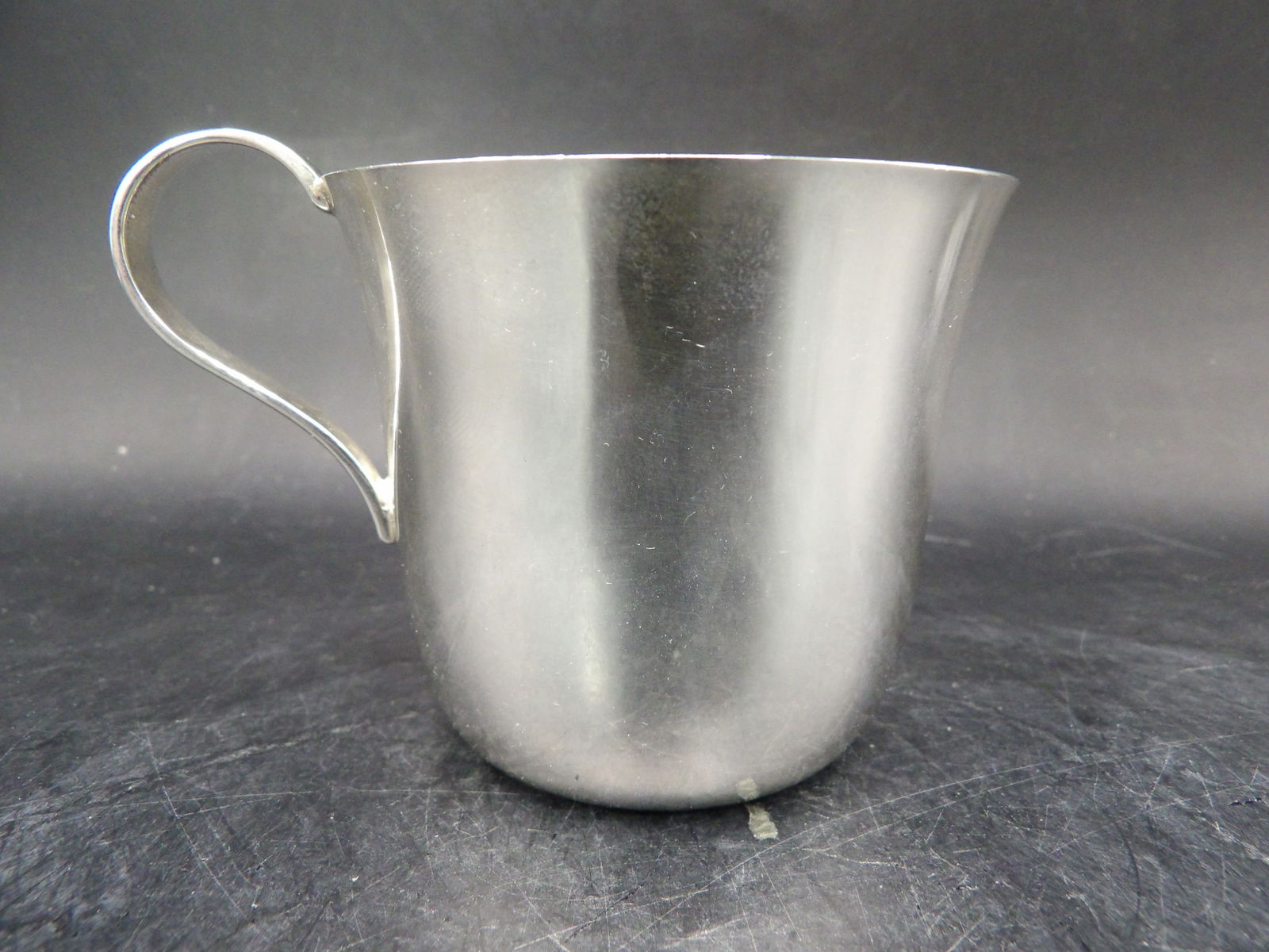 Tiffany & Co sterling silver baby cup 88 grams: Marked Tiffany & Co Sterling on the bottom. On side is engraved a baby name and DOB.