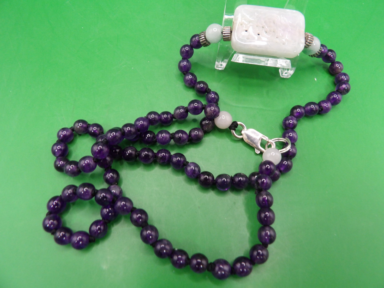 Chinese carved white jade pendant beaded amethyst necklace with sterling clasp: Stamped 925 on clasp. 21 inches long. 22 grams.