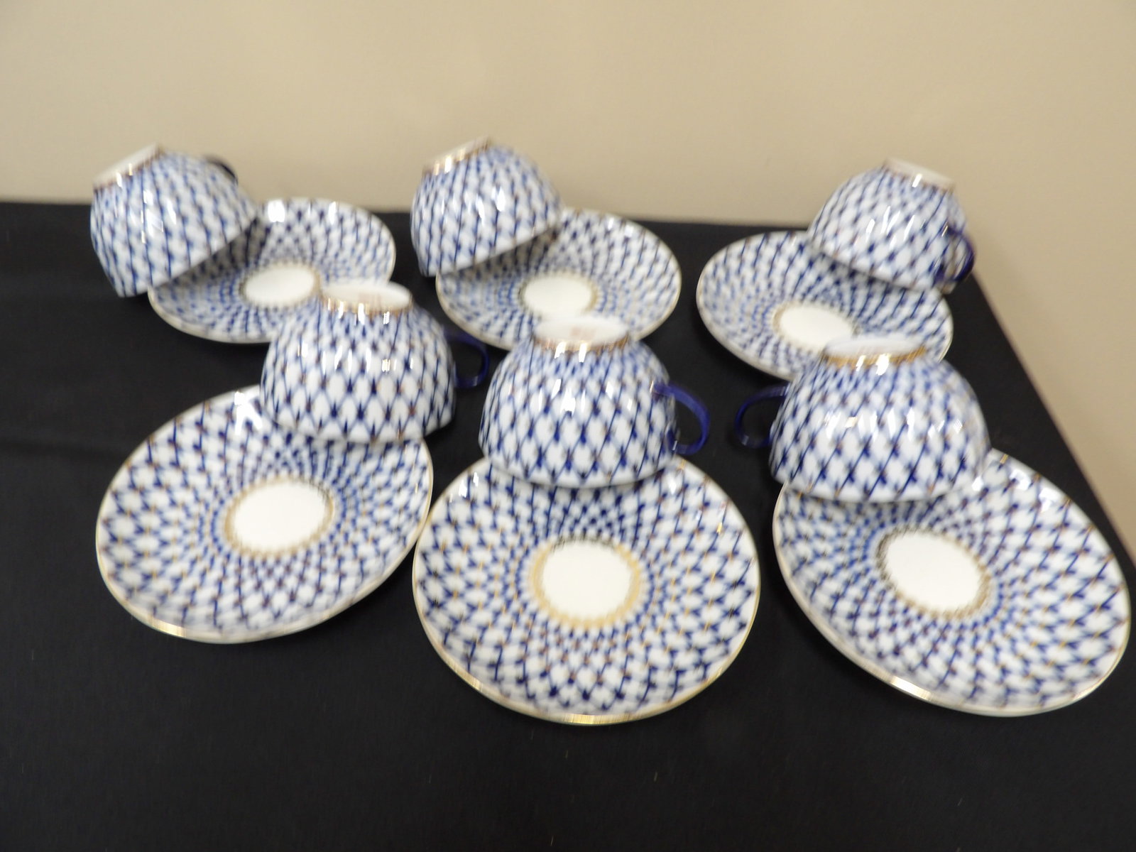 lot of 12 Imperial Russian Lomonosov Cobalt Net porcelain teacups and saucers: 6 sets teacups/saucers. Saucer is approx. 6 inches diameter.