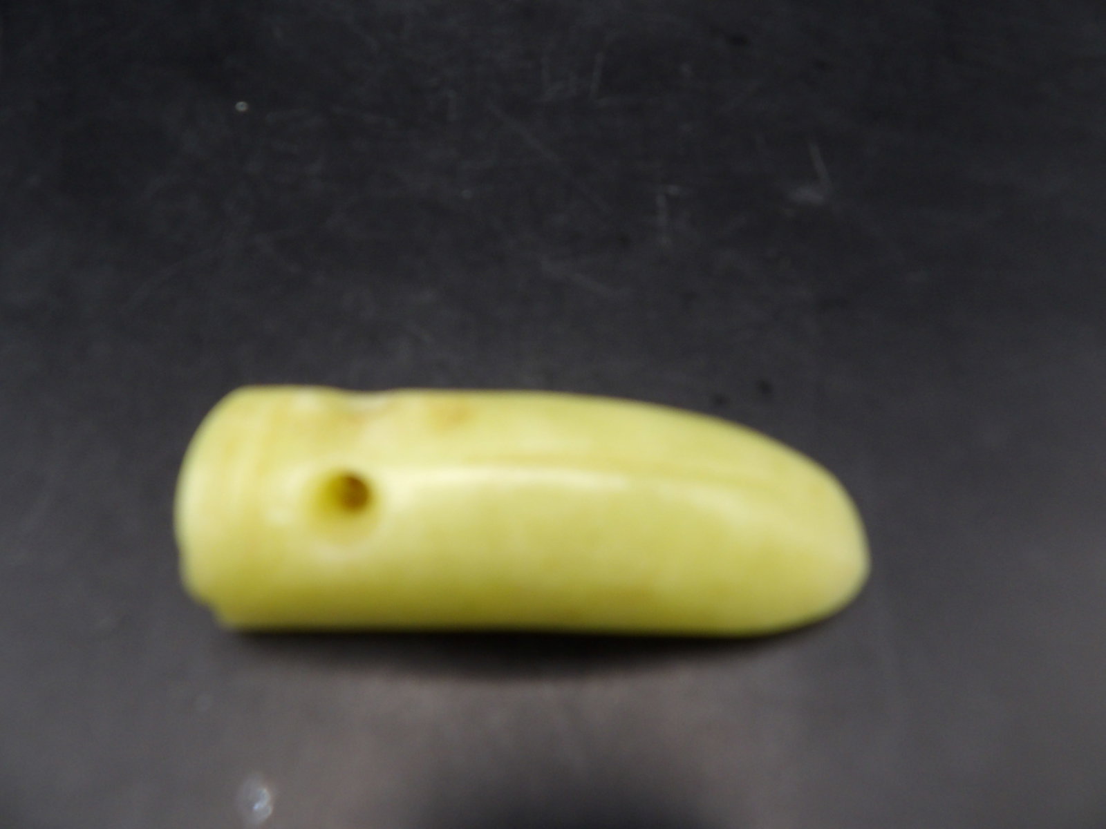 Chinese jade carved worm shaped pendant: 2.5 inches height. 42 grams.