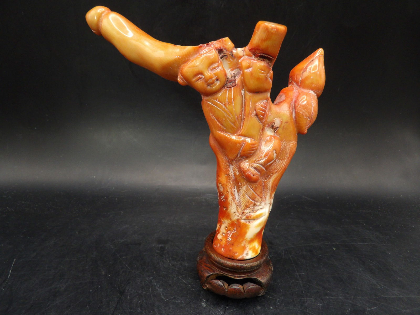 Chinese coral carved boy statue adhered to wooden base: 5.3 inches height.