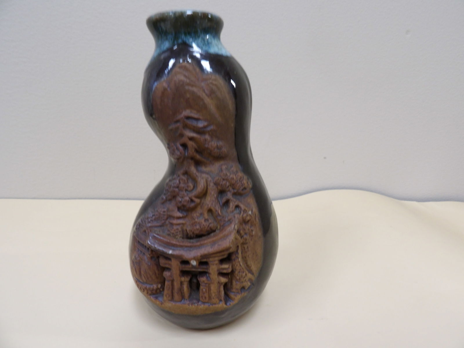 Japanese Banko ware ceramic vase with carved landscape and torii gate: 5.6 inches height.