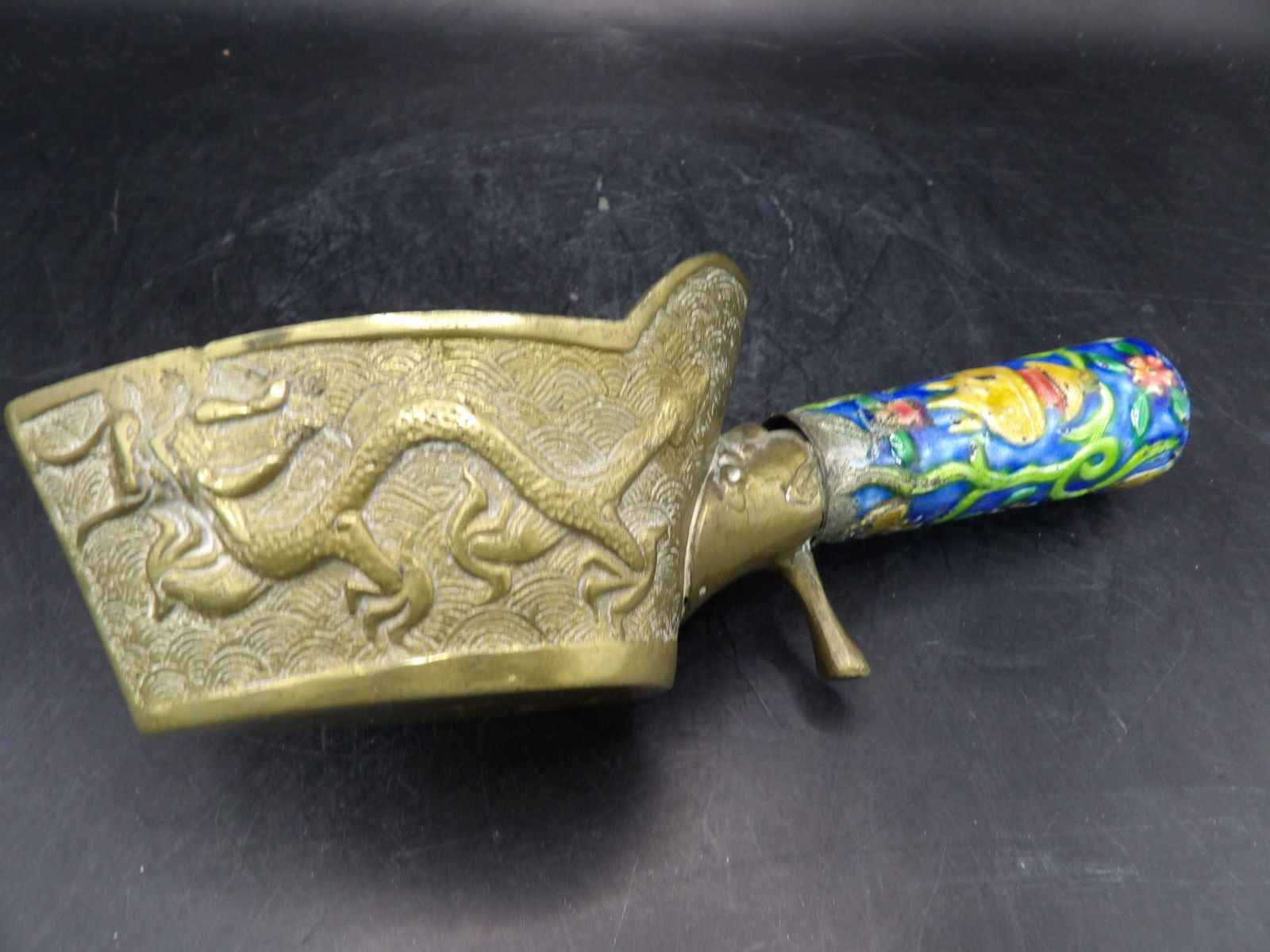 antique Chinese brass silk iron with dragon motif and cloisonne enamel handle: Marked China on the bottom. 7 inches length.