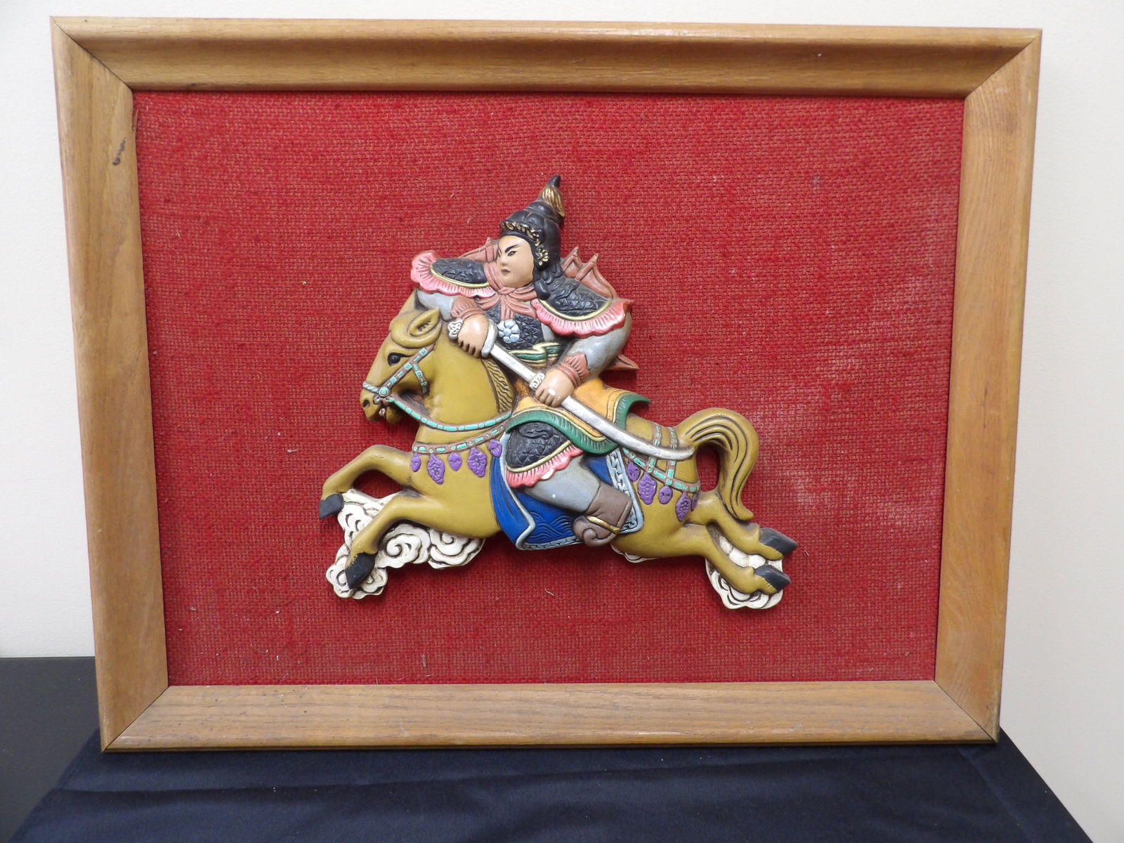 framed Chinese roof tile or relief of a warrior riding a horse: Frame size is 26.5 x 1.5 x 20.7 inches.