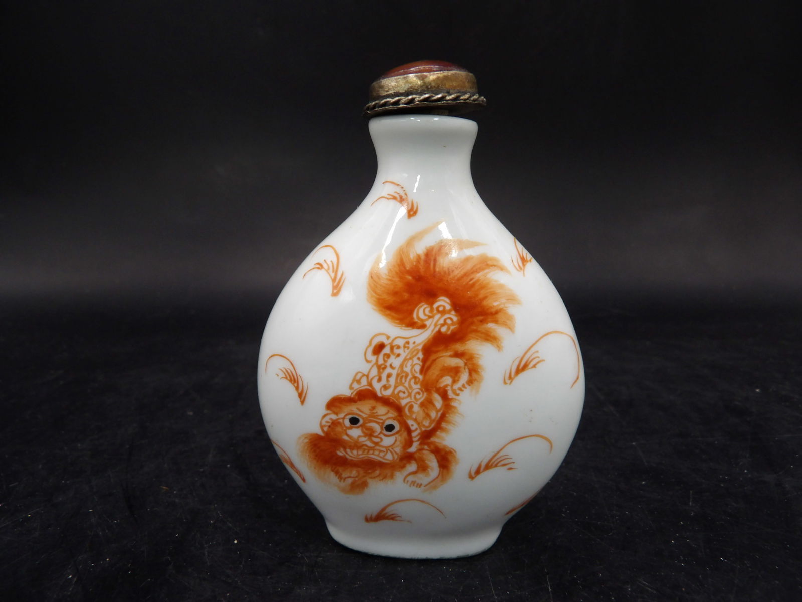 Chinese antique copper red glazed foo dog porcelain snuff bottle: 2.8 inches height.