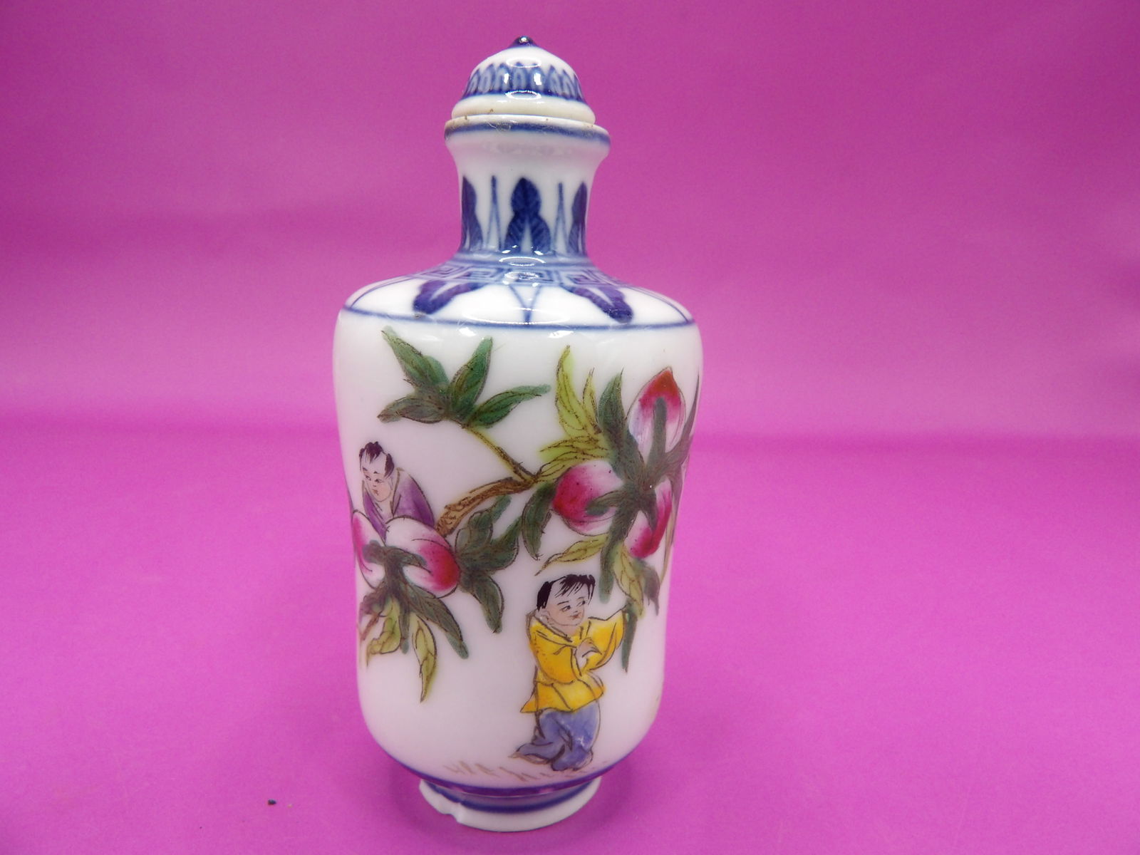 Chinese hand painted with boys and peaches porcelain snuff bottle with maker's mark: 2.8 inches height.