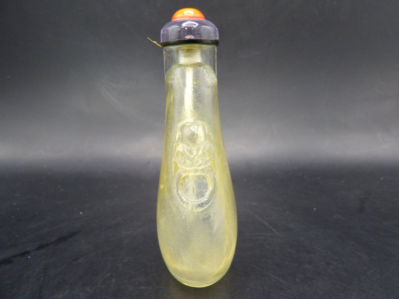 Chinese carved rock crystal snuff bottle with lion heads in padded box: 3 inches height.