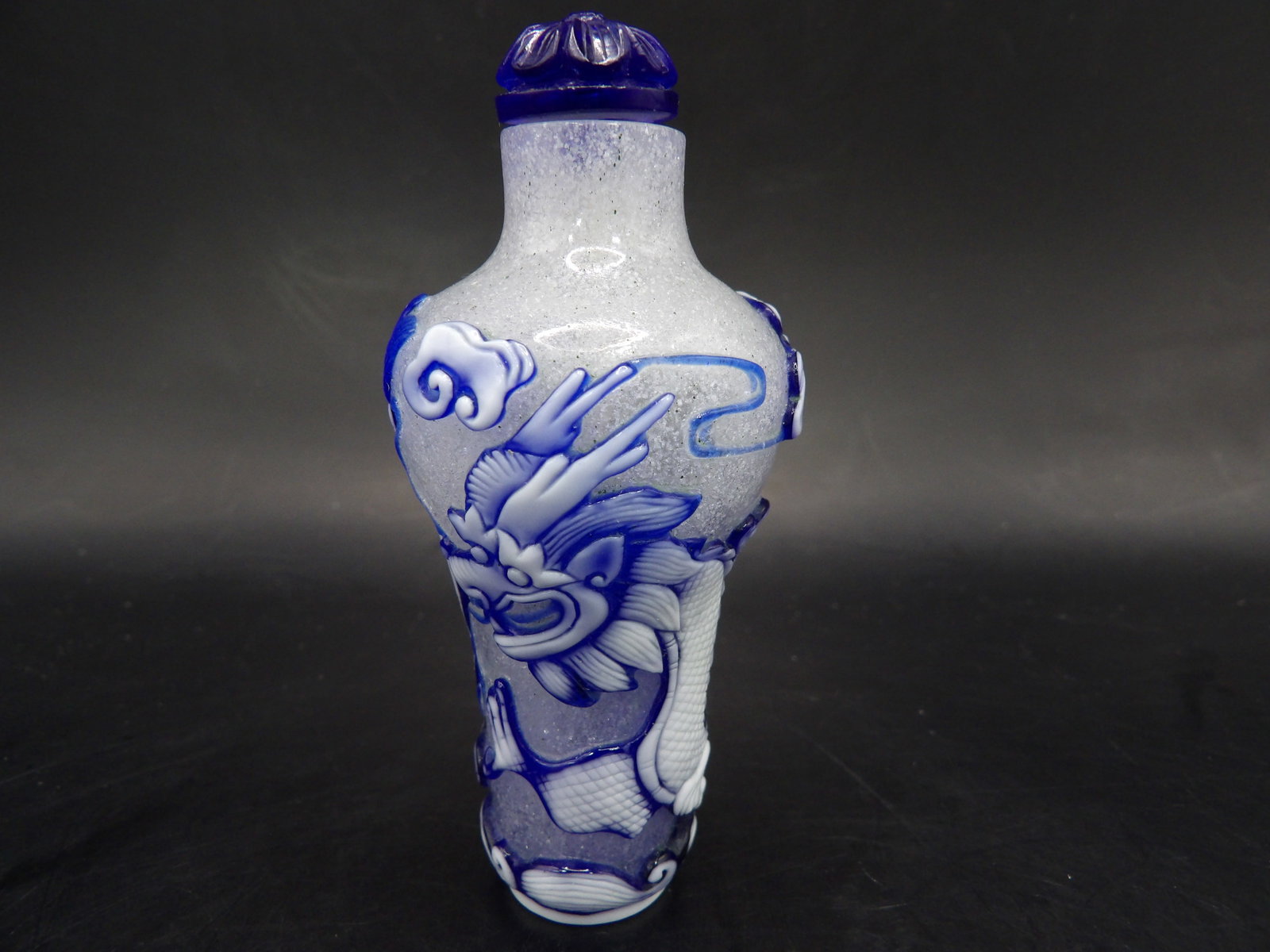 Chinese Qing dynasty frosted glass 2-color overlay snuff bottle with dragon motif (1 of 7)