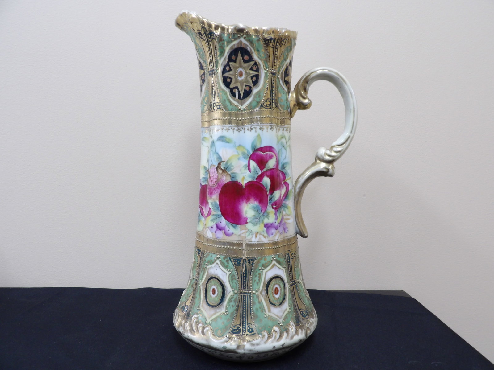 extra tall antique Nippon fine porcelain pitcher with hand painted fruits and gold trim: Approx. 16 inches height.