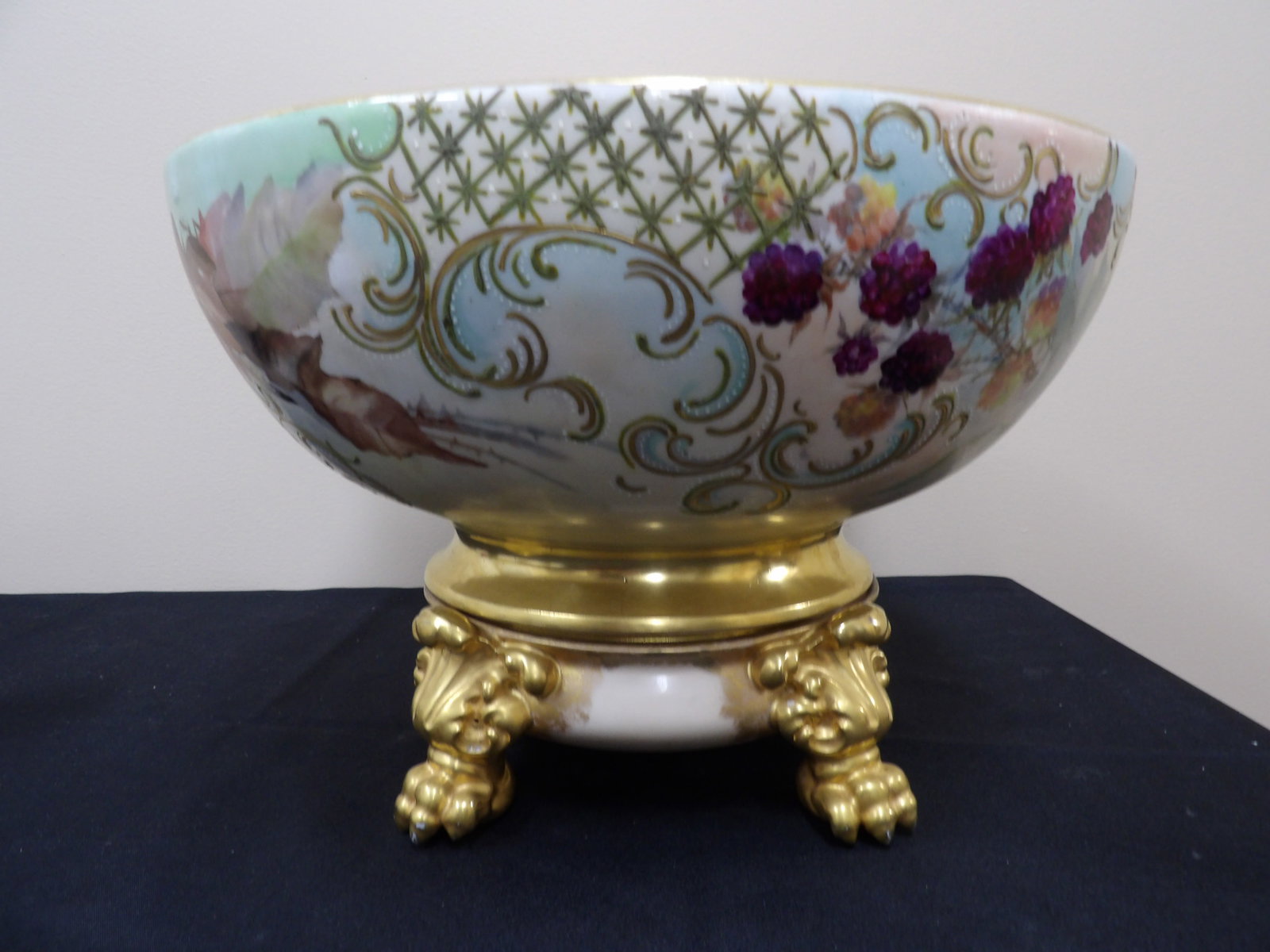 rare antique Limoges hand painted porcelain punch bowl with gilt footed base: Punch bowl is 15 inches opening. Size is 15 x 15 x 10 inches. Signed France on the bottom.